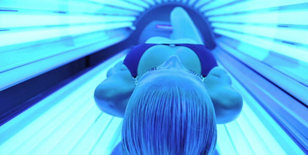 preparing to enter a tanning bed